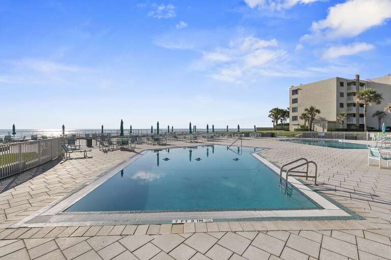 Enjoy resort-style relaxation at this beachfront pool overlooking the ocean and sun deck lounge