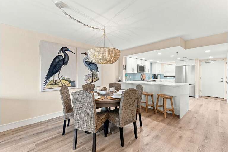 Gather for meals in this open-concept dining area with seating for the whole group, flowing into a