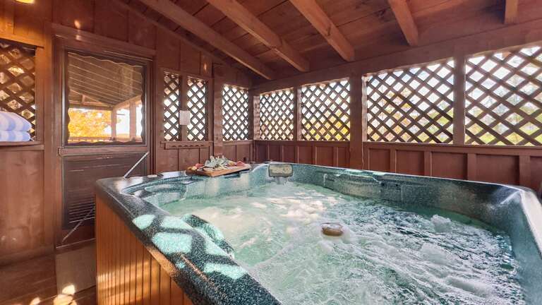 Unwind in your private hot tub with a glass of wine and mountain air — where relaxation meets rustic luxury.
