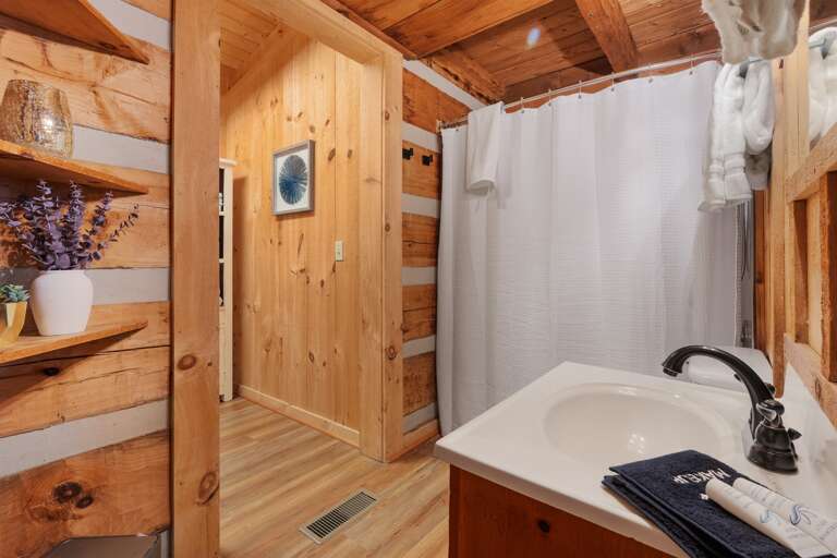 Warm wood tones and fresh linens — your private mountain retreat is ready for relaxation.