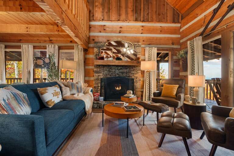 Settle into mountain comfort — plush seating, warm wood interiors, and cozy cabin charm made for slow mornings and long conversations.