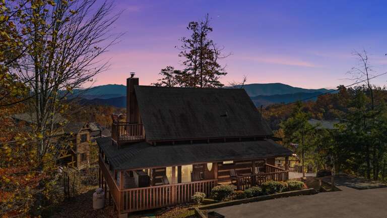 Unwind in rustic comfort — where warm wood tones, cozy textures, and Smoky Mountain charm create the perfect mountain retreat.