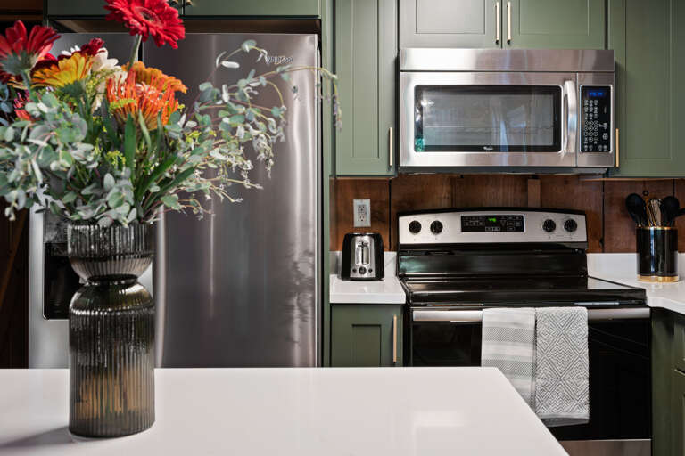 Fully stocked and beautifully finished, the modern kitchen at Dancing Embers makes it easy to cook up something special during your stay.