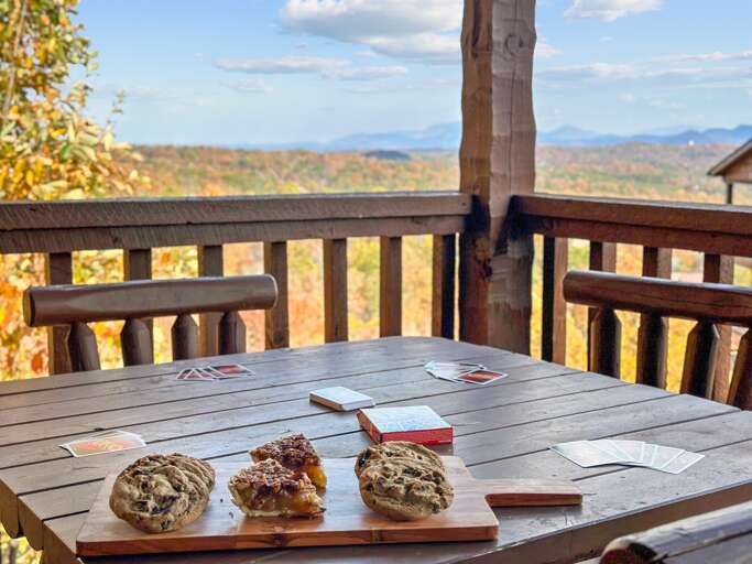 Dine among the trees — enjoy morning coffee or dinner with stunning Smoky Mountain views.