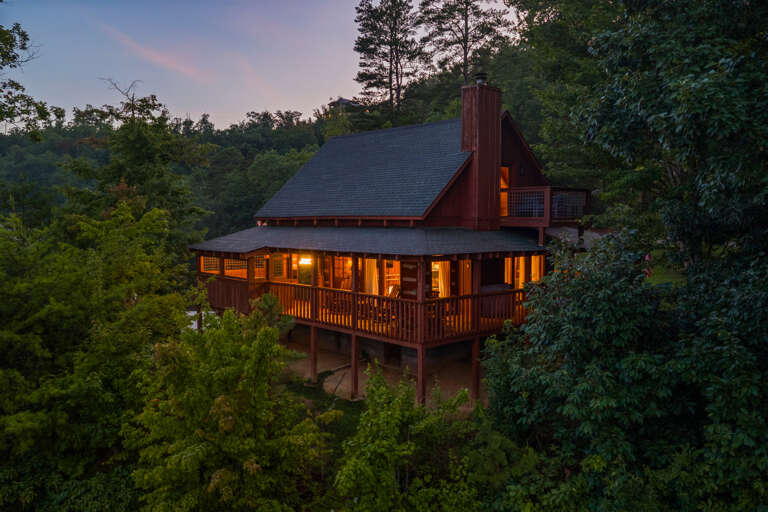 Perched among the treetops at sunset, Dancing Embers pairs modern design with sweeping Smoky Mountain views all your own.