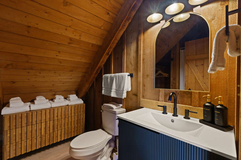 Convenient and beautifully finished, the loft-level bathroom at Dancing Embers keeps every guest comfortable.