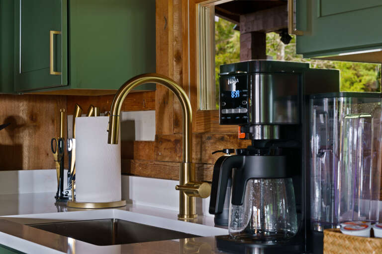Rise and brew — a well-appointed coffee station and modern sink make mornings easy at Dancing Embers.
