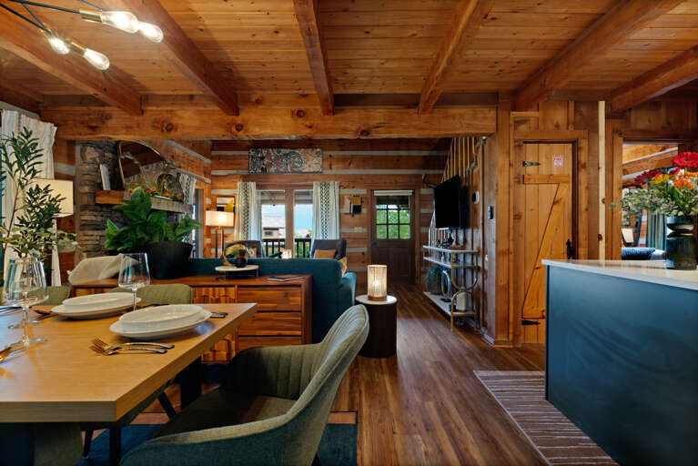 Cook, dine, and connect in one beautifully designed space — the open kitchen and dining area at Dancing Embers was made for shared meals.
