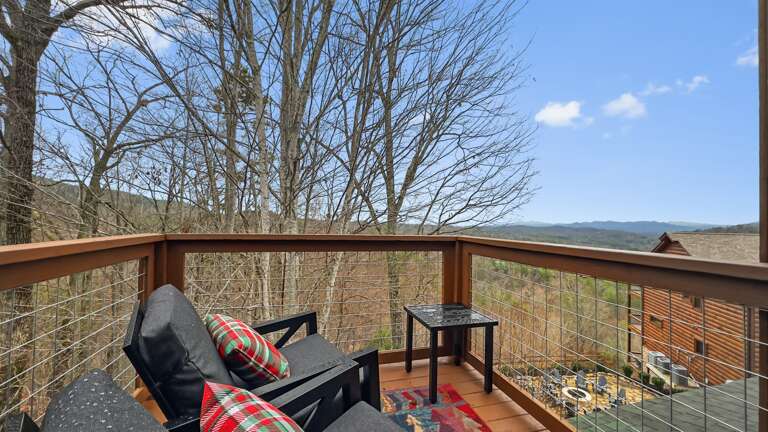 Cozy up with a blanket and take in peaceful Smoky Mountain views from the loft deck—relaxation at its finest.