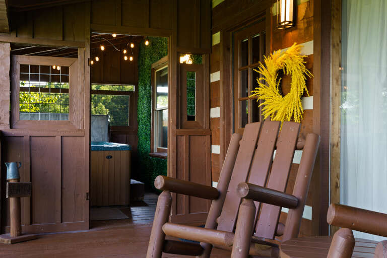 Relax the evening away on the covered porch — the perfect spot to greet the mountain morning or wind down at sunset.