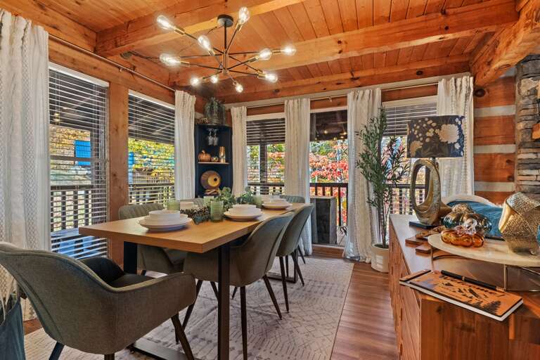 Gather for laughter, meals, and memories — this warm cabin dining space is made for connection.
