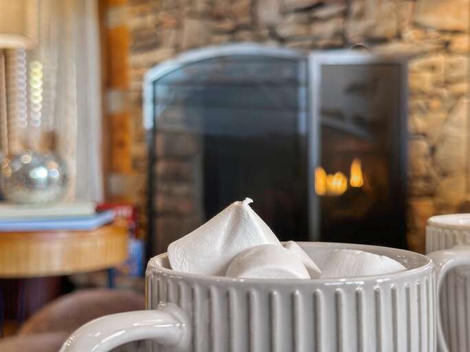 After an exciting day in the Smokies, unwind with warm drinks and a glowing fireplace at Dancing Embers.