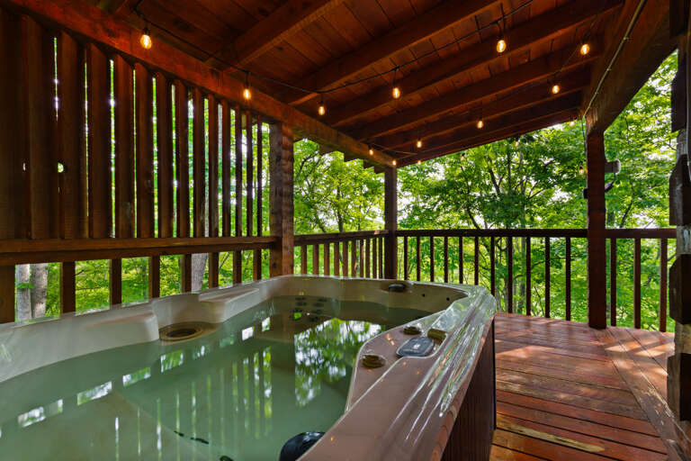 Bubble away the stress of everyday life in the private hot tub at Nestled Oaks, tucked into the quiet Bluff Mountain woods.