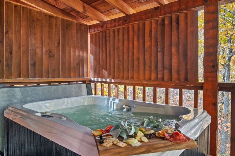 Soak, sip, and savor — your private hot tub retreat surrounded by peaceful Smoky Mountain woods.
