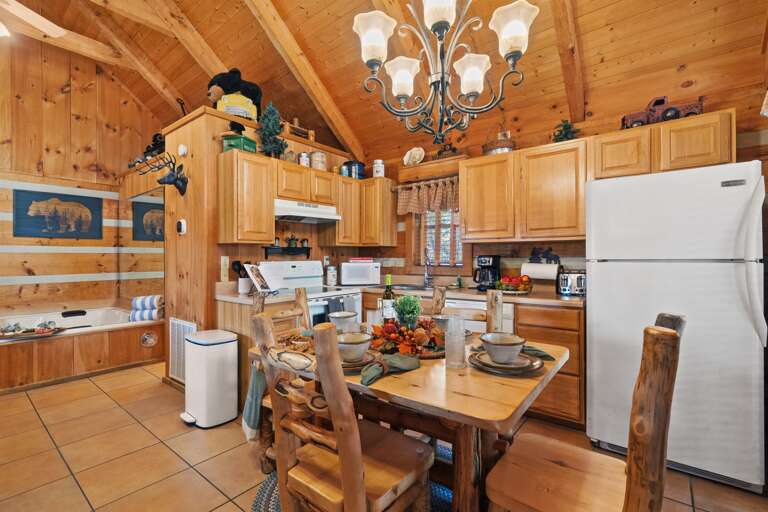Fully equipped kitchen and rustic dining space — everything you need for home-cooked mountain meals.