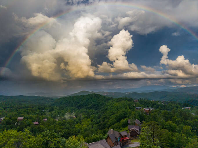 Big Smoky Mountain views and the occasional rainbow are all part of the magic surrounding Nestled Oaks.
