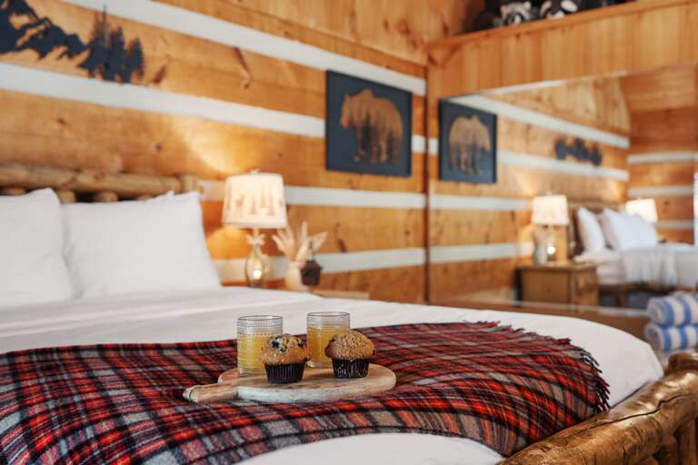 Thoughtful details and a comfortable studio bedroom with handcrafted furnishings, designed for a relaxed Smoky Mountain stay at Nestled Oaks.