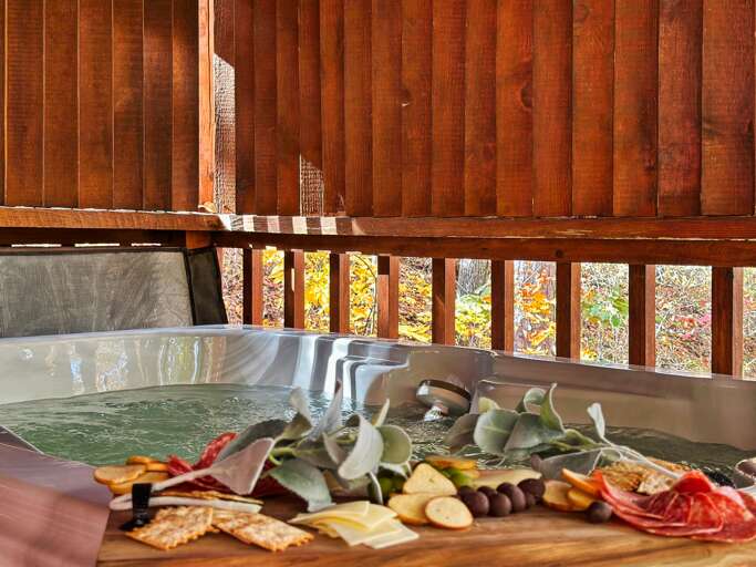 Soak in pure relaxation — your private hot tub awaits, complete with forest views and cozy cabin privacy.