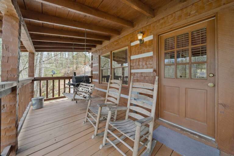 Wooden Porch With Rocking Chairs And Swing
