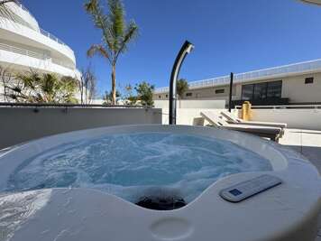 Beachfront Apartment w/ Terrace, Hot Tub & Parking