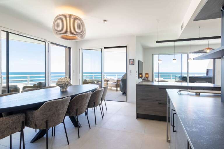 Seaside Space With Sunlit Seating And Serene Sea View