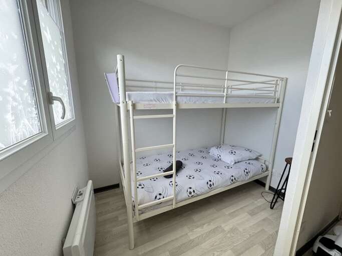 Bunk Bed Beside Bright Window