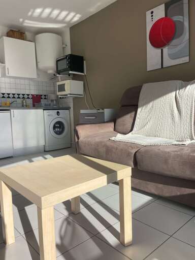 Compact Kitchenette, Comfy Couch, Table, Washing Machine