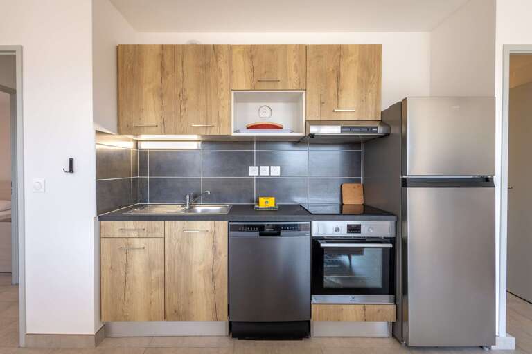 Kitchen Corner With Cabinets, Counters, Appliances