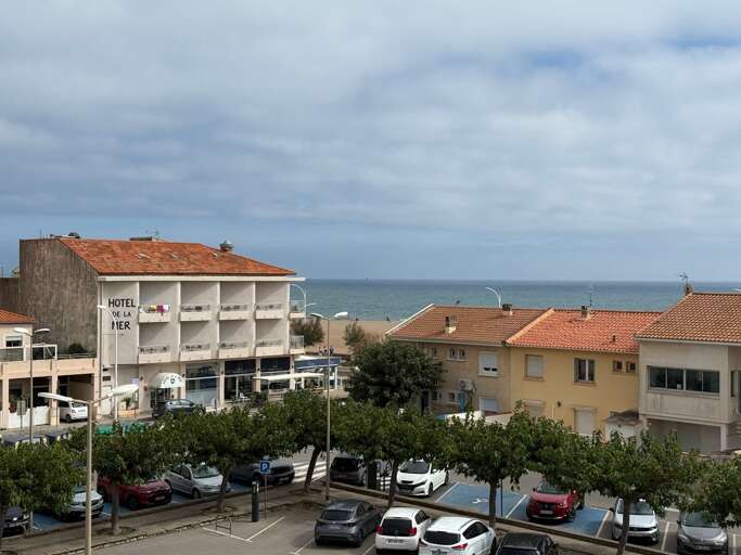 Seaside Street Scene With Cars And Distant Ocean