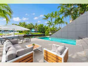 Biscayne Bay Modernist 3-Story Waterfront Villa with Private Lift, Gym &amp; Deep-Water Jetty