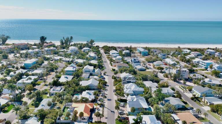 Aerial view of coastal home near the beach