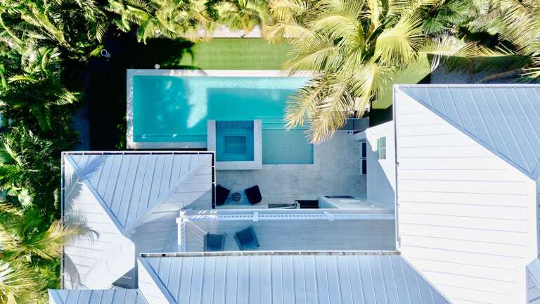 Aerial view of home with private pool and spa