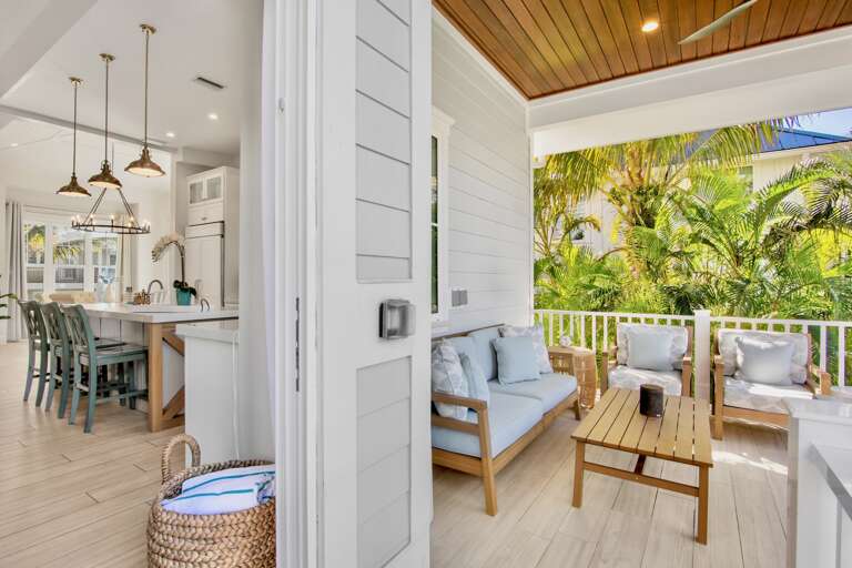 Private covered terrace with seating and BBQ grill