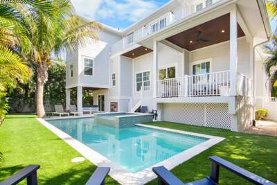 Private pool and spa surrounded by lush palm trees