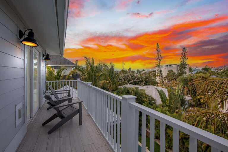 Sunset views paint the sky in vibrant colors from your private balcony