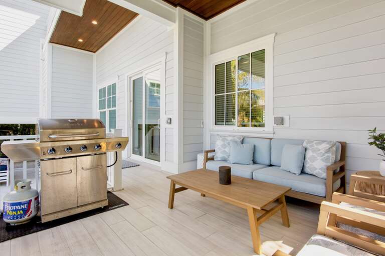 Unwind on your private covered patio with comfy seating and BBQ grill