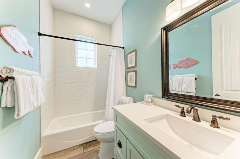 Third bathroom with tub and shower combo