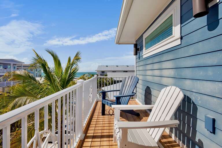 Private balcony with adirondack chairs