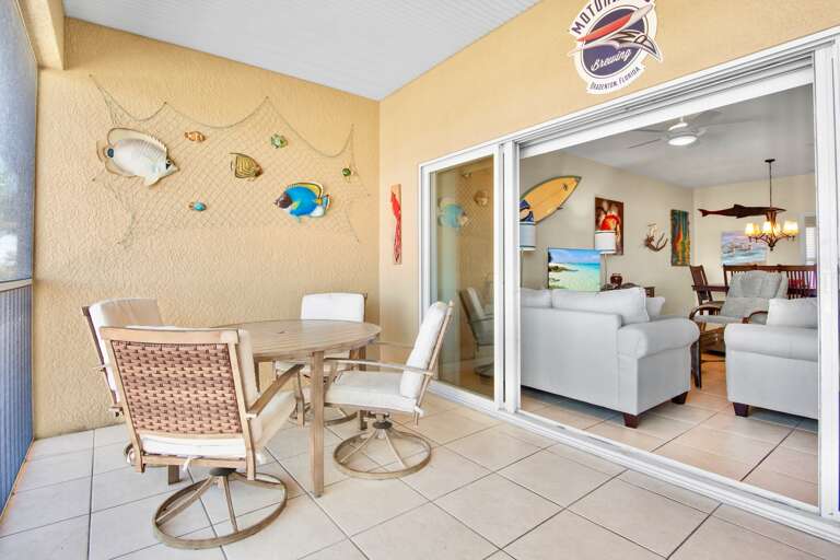 Screened-in balcony with dining table