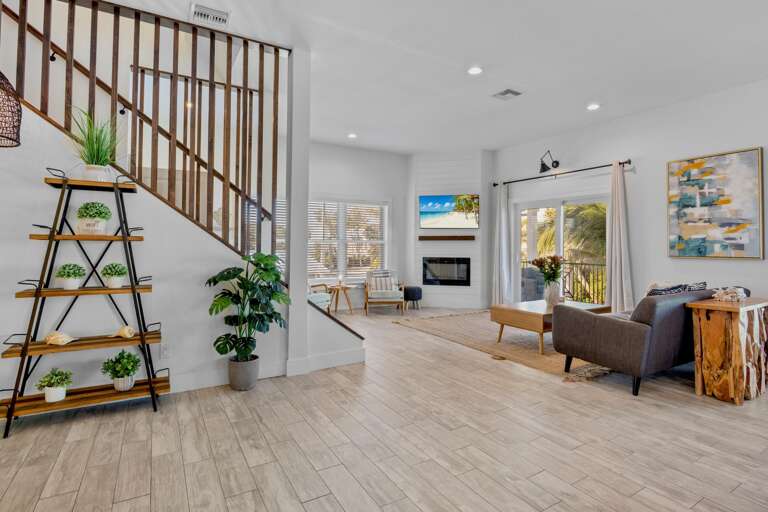 Living area with modern fireplace, cozy seating, and TV