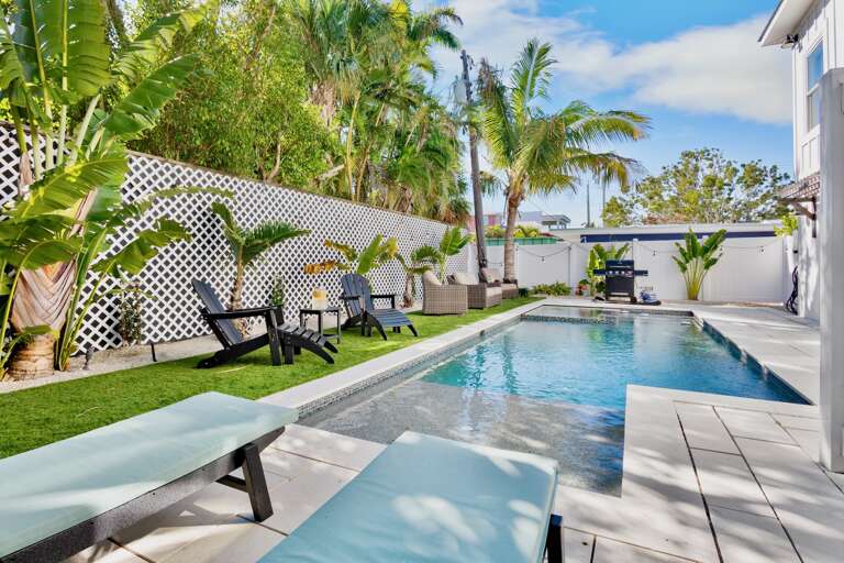 Tropical oasis with a pool and comfortable loungers