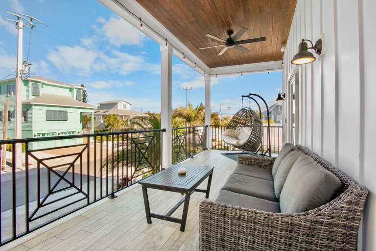 Private covered balcony with comfortable seating
