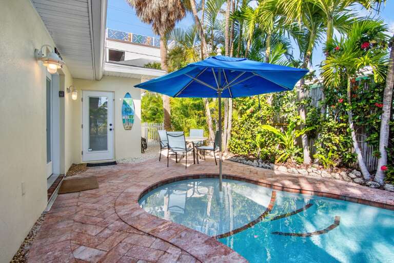 Your private pool oasis awaits with tropical landscaping for ultimate relaxation