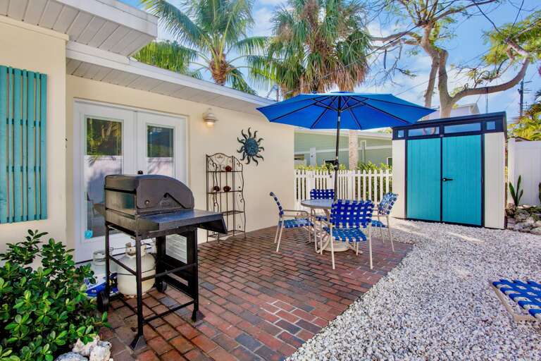 Enjoy outdoor dining and grilling in your private patio space, complete with BBQ facilities, comfortable seating, and tropical charm.