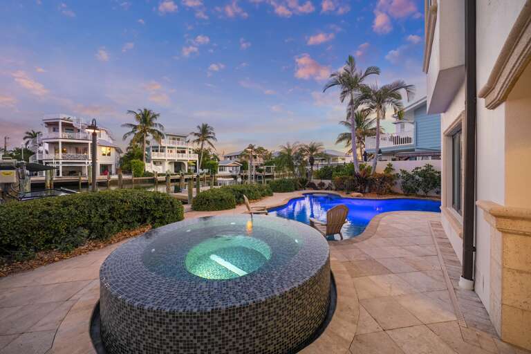 Private pool and spa surrounded by tropical palms