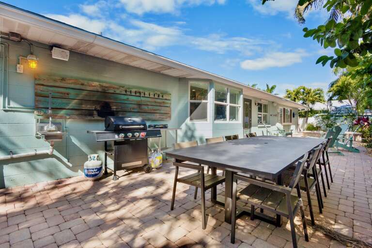Outdoor dining table with BBQ grill
