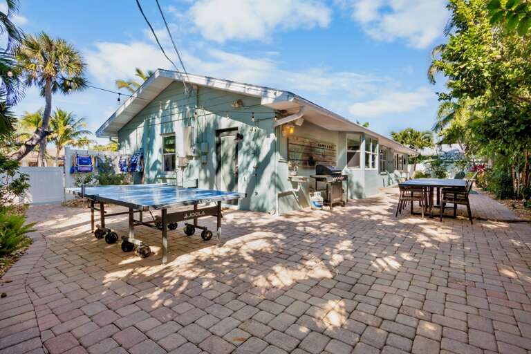 Outdoor dining, ping pong, and BBQ area
