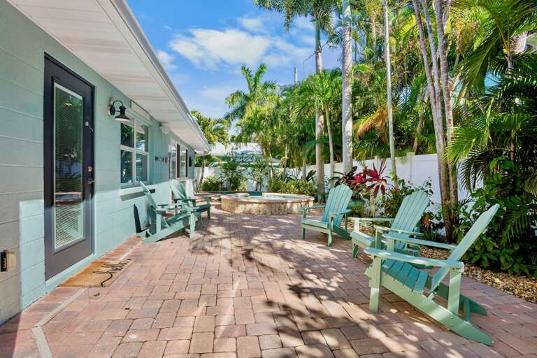 Private patio with adirondack chairs