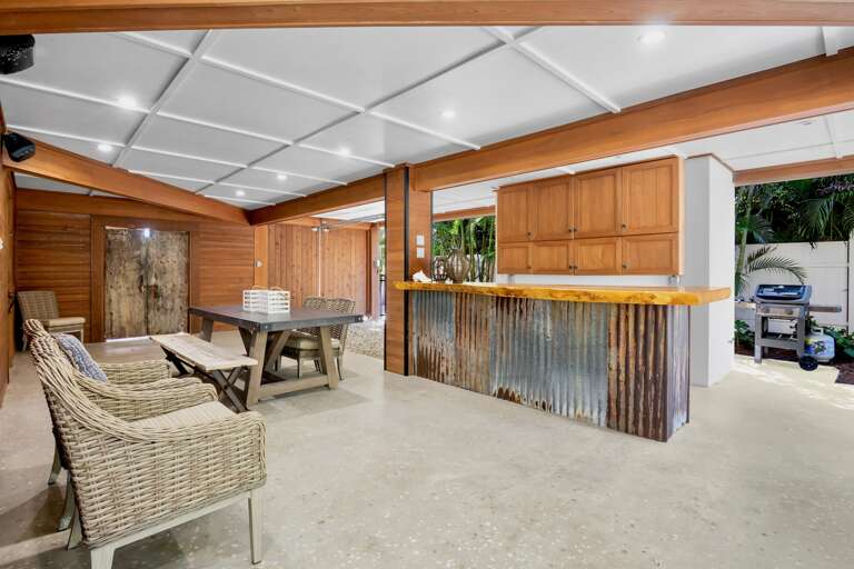 Covered outdoor kitchen with comfortable seating