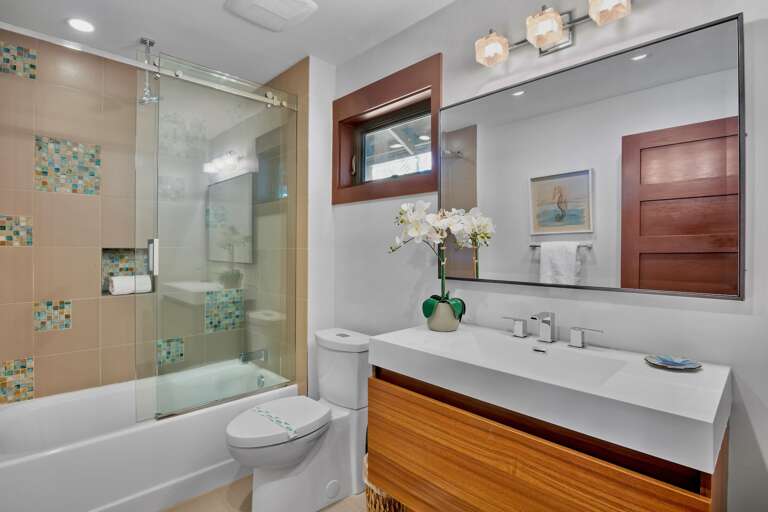 Second bathroom with tub and shower combo